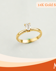 A 14K gold solitaire ring with a oval-cut clear gemstone