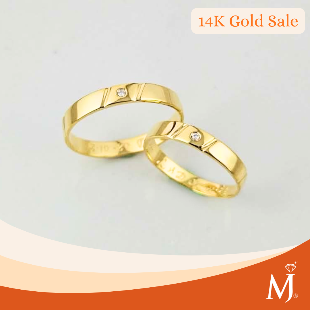 Two gold wedding bands with small round-cut diamonds