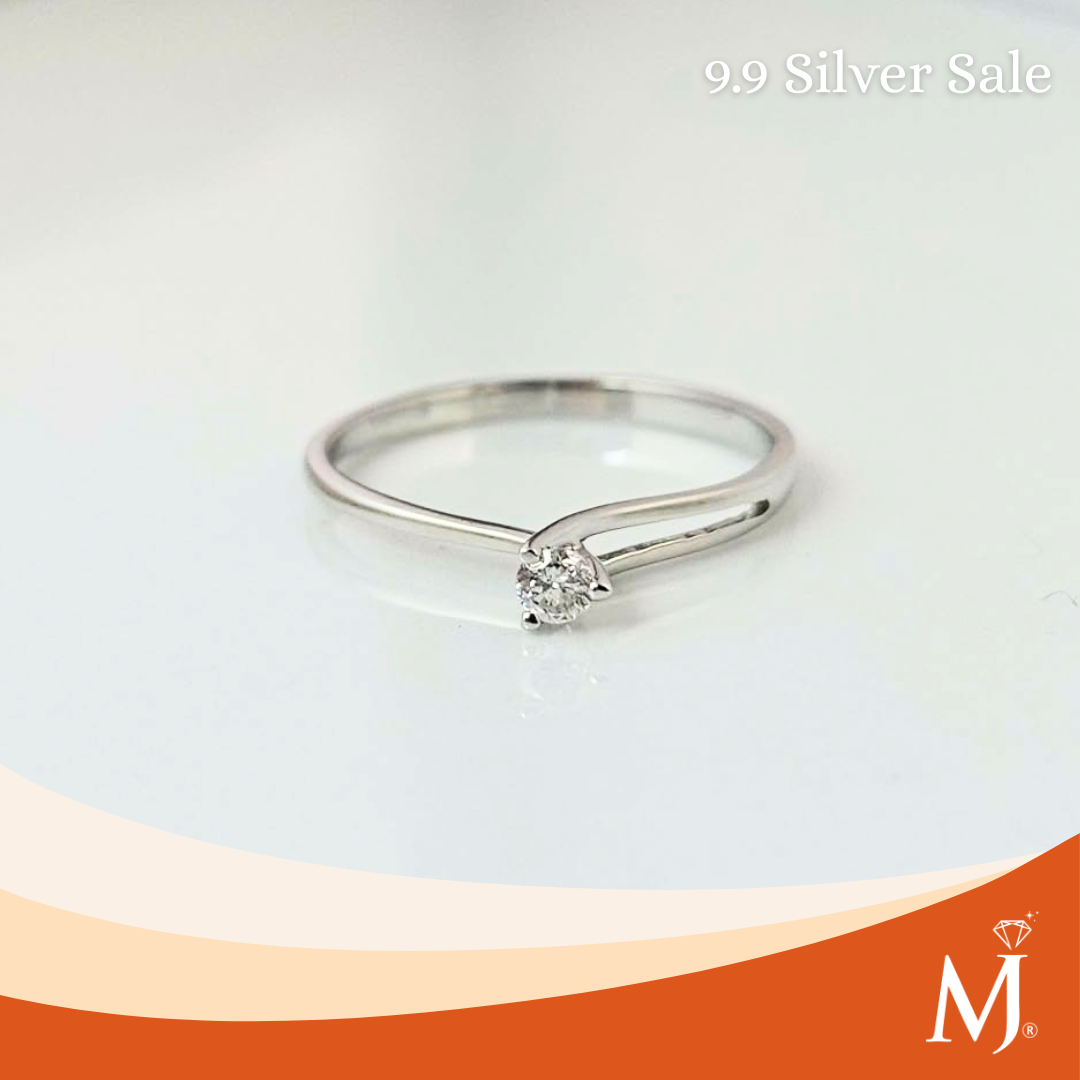 A silver solitaire ring with a round-cut clear gemstone
